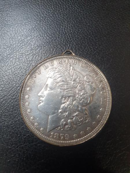 Hello, i have an 1879 dollar coin and…