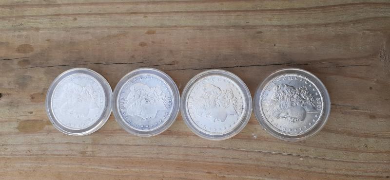 1878, 1879, 1881, and 1898 silver dollars in…