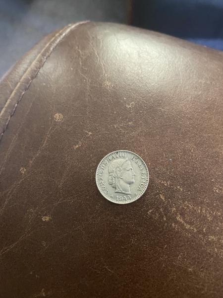 Silver coin with a 20 on back