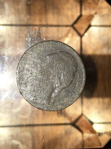 I found this coin it’s dark brown 2000…