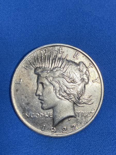 Requesting basic evaluation of 1922 Peace Silver Dollar.…