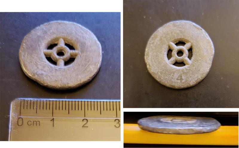 Wheel shaped coin with number "4" on one side, 28&hellip;