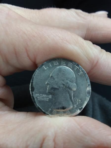 1989 quarter appears to have foil around edge.