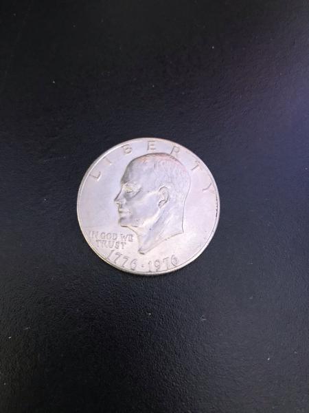 Silver one dollar coin with Eisenhower on one&hellip;