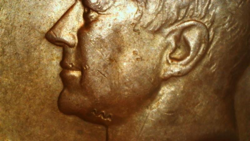 1968 half dollar, with unusual marks on upper…