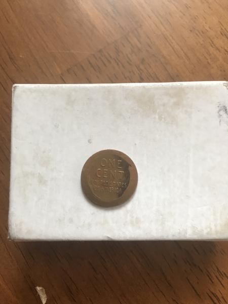 1945 wheat penny some of his jacket is…