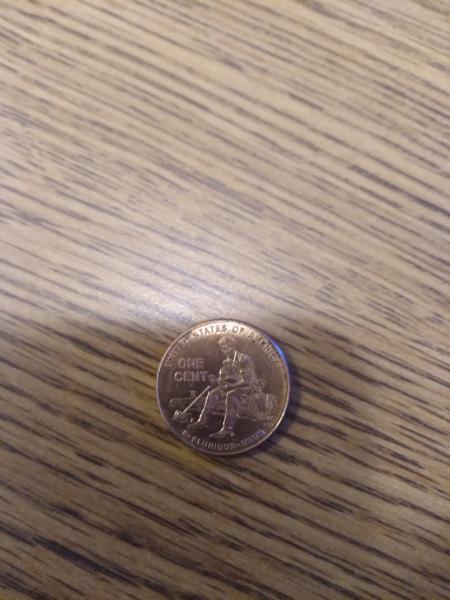 2009 penny with Lincoln on a log no…