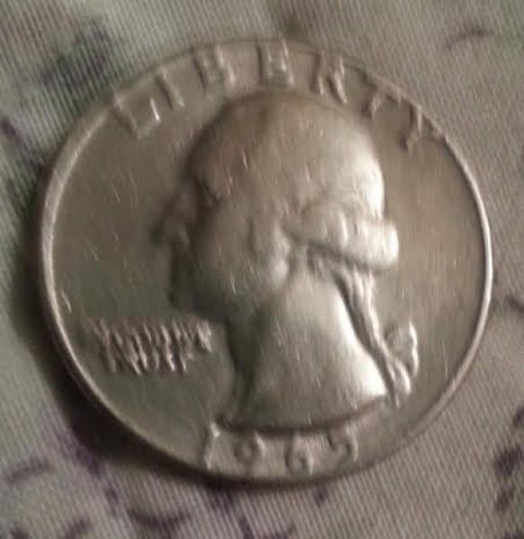 1965 error coin struck wrong.