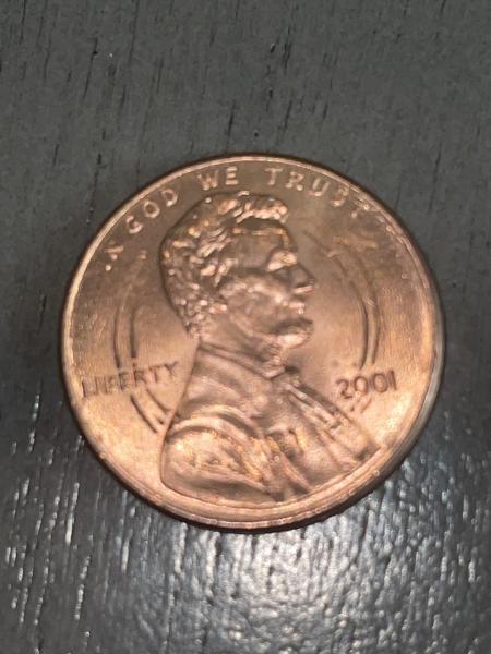 A 2001 U.S. penny with smaller “rings” on&hellip;