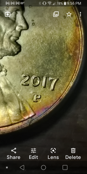 Rainbow tone with a P over D mint mark