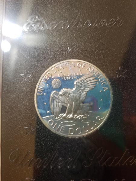uncirculated 1972 s Eisenhower proof dollar.