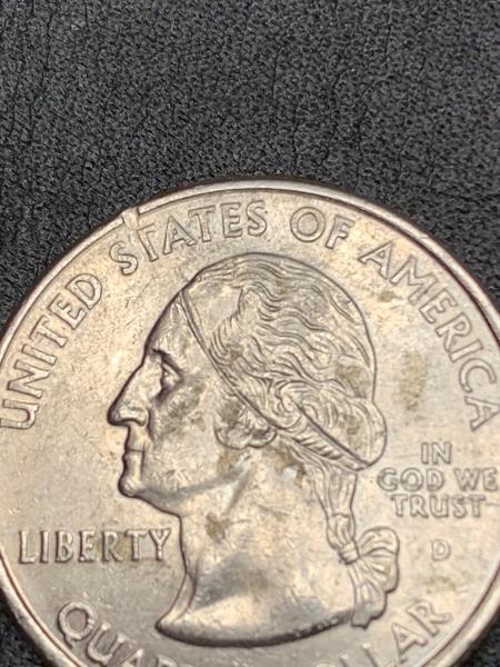 2006 North Dakota state Quarter with a line…