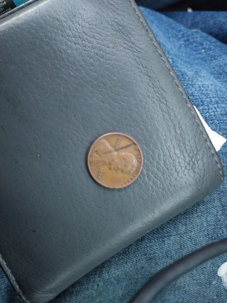 1944 wheat penny has obstruction across coin seems…