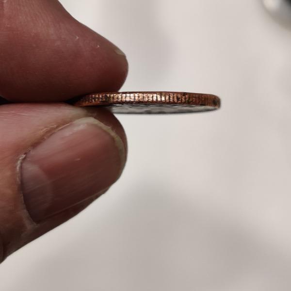 1900p quarter missing clad on obverse and reverse