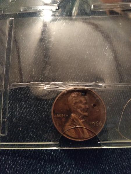 Its a 1966 penny with two holes in&hellip;