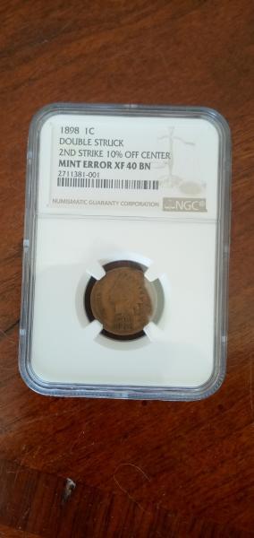1898 double struck,second strike ten percent off center,…