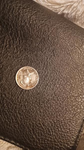 It's a 1944 Philippines ten centavos silver coin