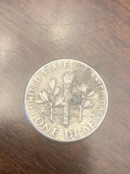 1966 Dime with error mark on cheek