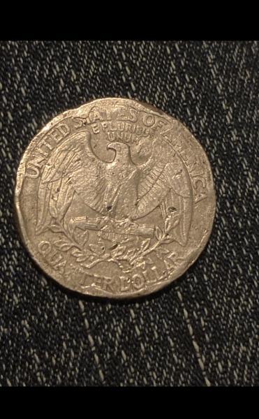 Found a beat up coin in a roll…