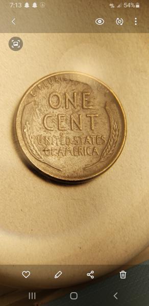 Looks like 1955 penny with the finger print…
