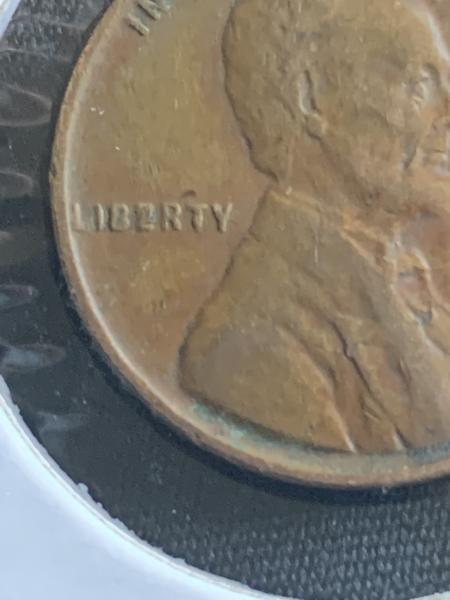 1945 Lincoln Wheat Cent Liberty is spelled Lib2rty