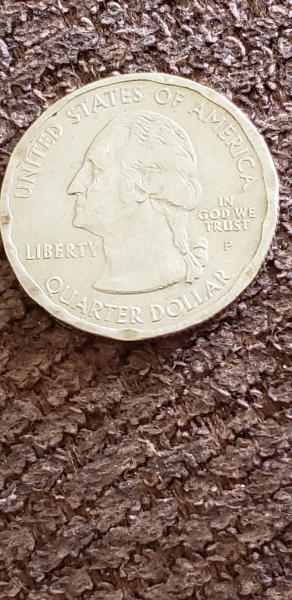 This quarter has a flattened rim on both…