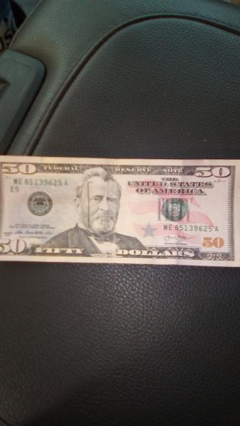 Abnormal face on $50 bill.