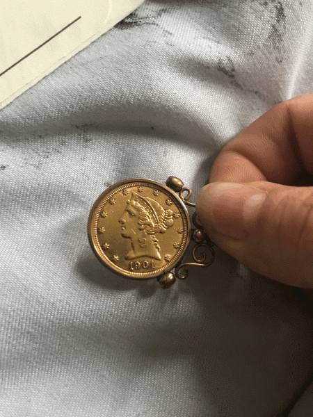 Small united states gold 1901 coin that was incased in&hellip;
