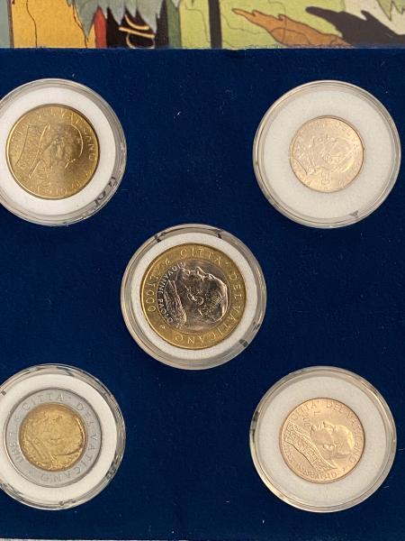 Vatican coins with different popes .