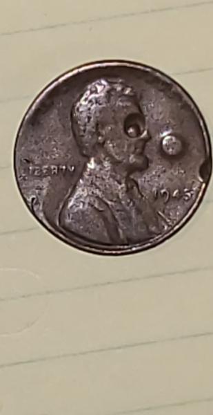 1943 Lincoln penny with some kind of strike error.