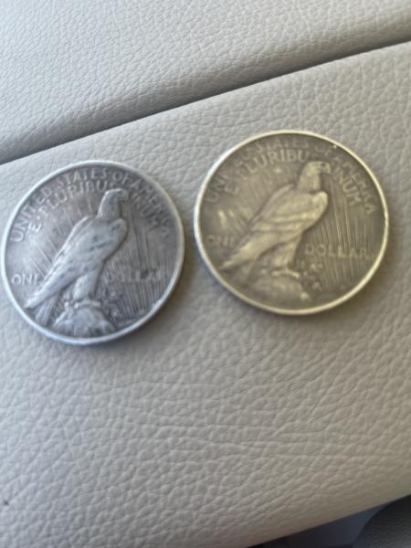2 silver dollars one from 1922 and the…