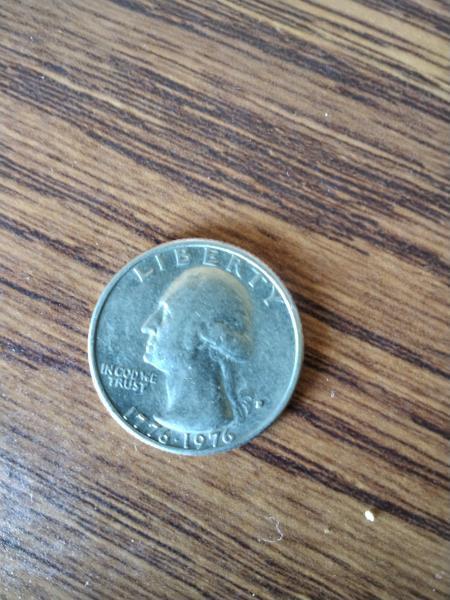Quarter dollar with "1776-1976" on front