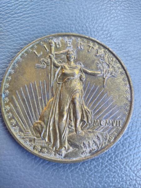 20 dollar piece with MCMVII date.