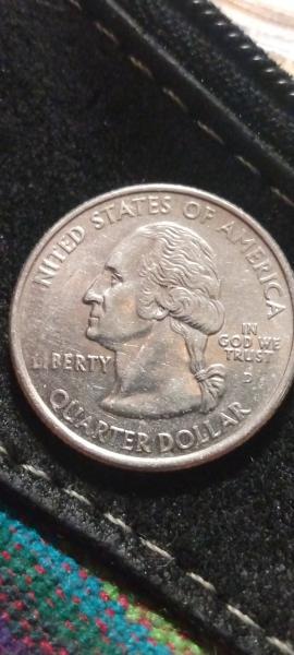 Error on state quarter missing the U in…
