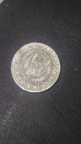Coin says Continental Curency 1776 abd FUGIO on one side&hellip;