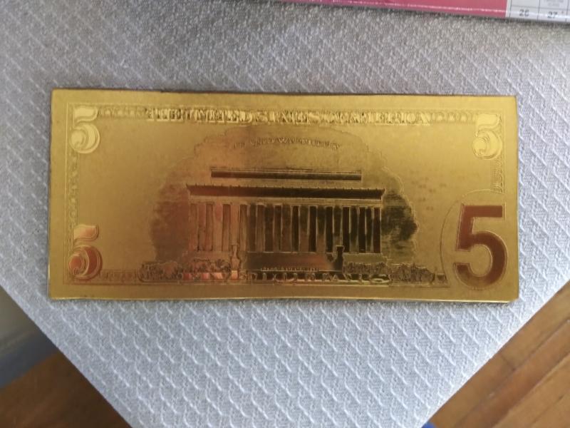 $5 paper money.