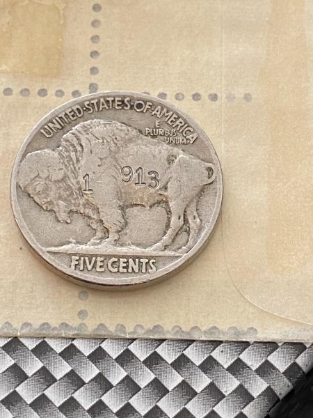 Indianhead coin with number stamped