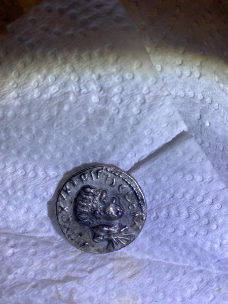 Maybe silver coin with images raised and foreign&hellip;