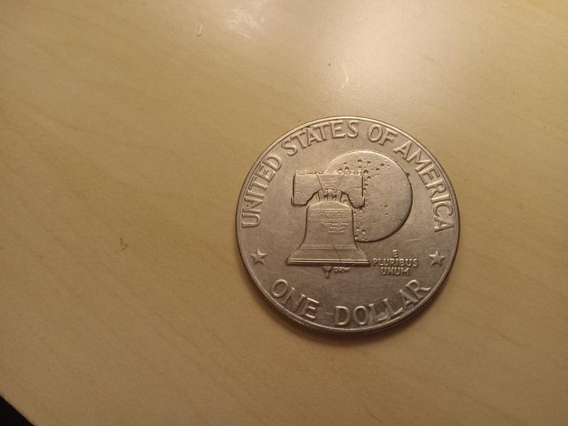 It is a no mint mark 1976 silver…
