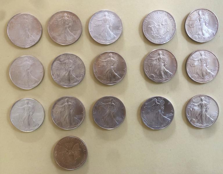16 uncirculated silver dollars, some with light tarnish…