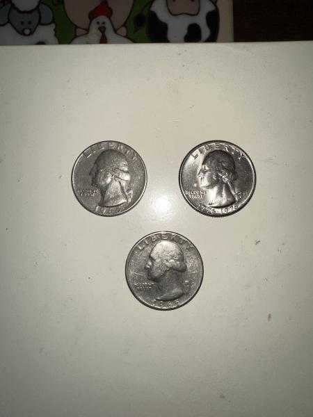 Two silver 1965 US quarters and a 1776-1976 quarter.