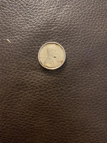 Odd colored/plated penny. Almost a cross between a…