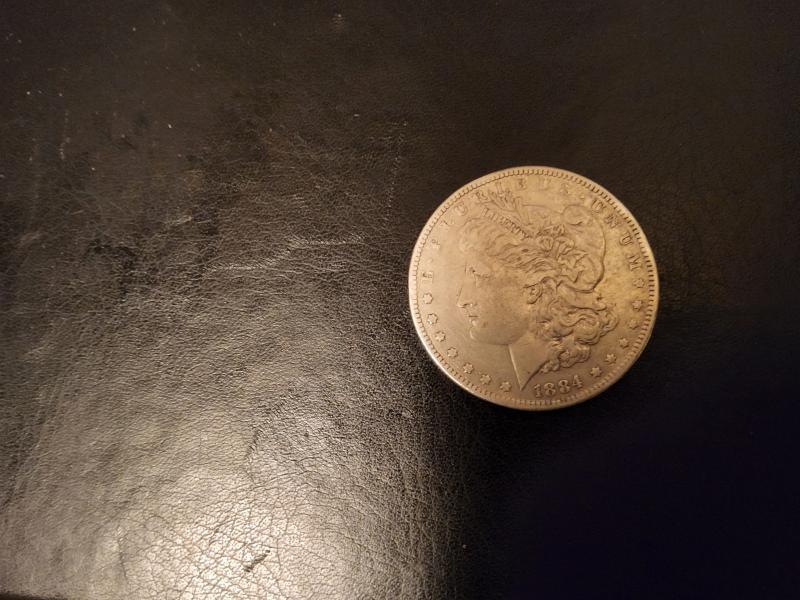 This 1884 Morgan Silver Dollar has what i…