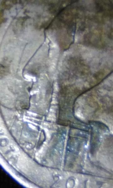 Has multiple faces on one side and looks…