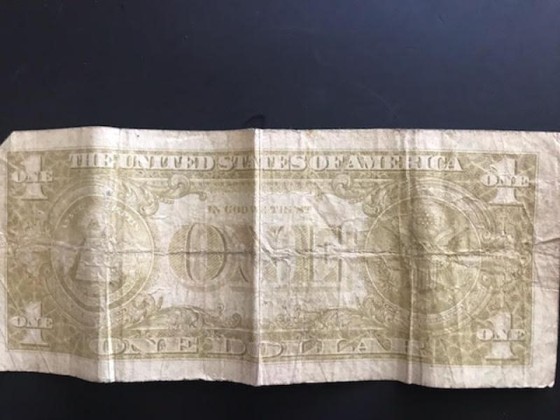 1963 dollar bill without a serial number.