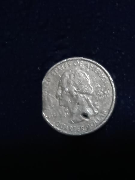 25 cents error coin the last picture I'd…