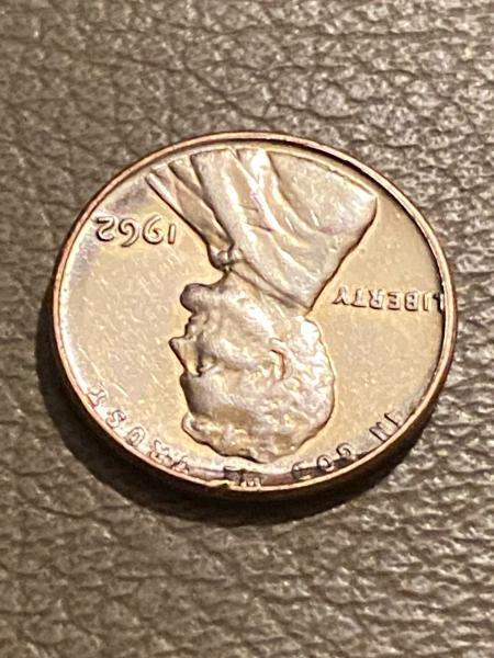 1962 penny no mint mark “L” stamped sideways…