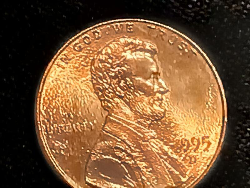 The penny is wrinkle both sides