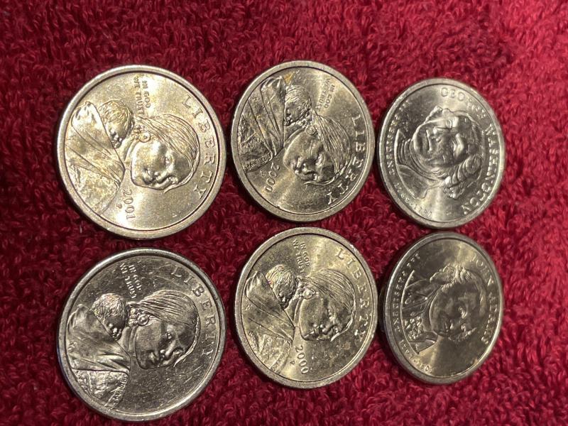 6 Gold $1 coins…2 presidential…4 Sacagawea