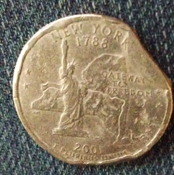 2001 us quarter distorted letters rippling surface curled…